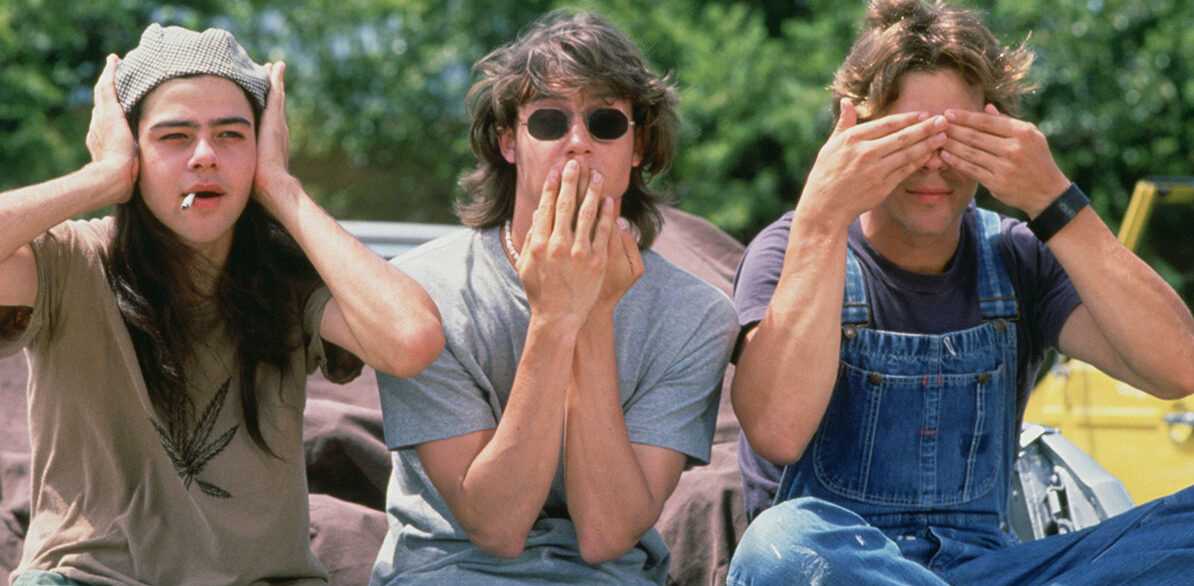 A Film still from Dazed and Confused featuring Sasha Jenson as 'Don', Jason London as 'Pink', and Rory Cochrane as 'Slater'.
