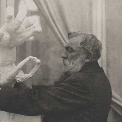 Unknown photographer, Rodin placing the plaster 'Clenched Hand with Imploring Figure' on a pedestal, in the Pavillon de l'Alma, Meudon, 1906. Musée Rodin