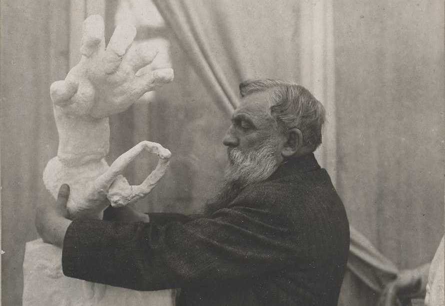 Unknown photographer, Rodin placing the plaster 'Clenched Hand with Imploring Figure' on a pedestal, in the Pavillon de l'Alma, Meudon, 1906. Musée Rodin