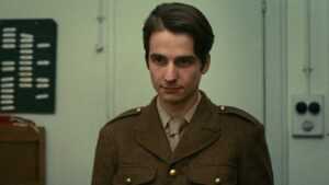 A film still from Stolen Kisses featuring Antoine Doinel wearing a military uniform. 