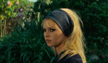A film still from Godard's Contempt with Brigitte Bardot in profile wearing a black headband.