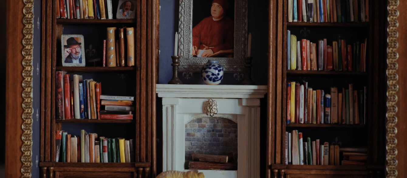 A film still from Umberto Eco: A Library of the World with a miniature replica of a library.
