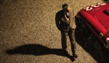 Adam Driver as Enzo Ferrari (red). Photo Credit Lorenzo Sisti