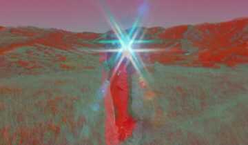 A Film Still from Last Things. A person stands in the middle of a grassy field surrounded by hills, the upper half of their body obscured by a star-shaped lens flare in the center of the image. The color of the image is affected by the camera’s filter; the person’s body and the hills behind them are a vibrant red, the sky a magenta, and the grass a mix of sage green and red.