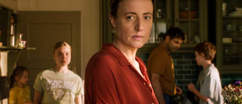 A film still from The Sparrow and the Chimney featuring Karen and family in kitchen