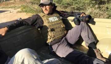 A film still from Armed With only a Camera: The Life and Death of Brent Renaud